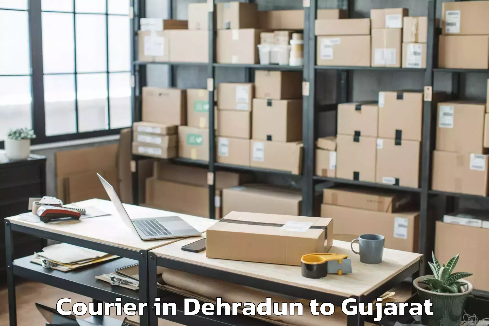 Top Dehradun to Khambhaliya Courier Available